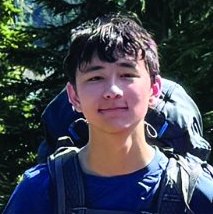Rylan Shulman on a hike with a backpack